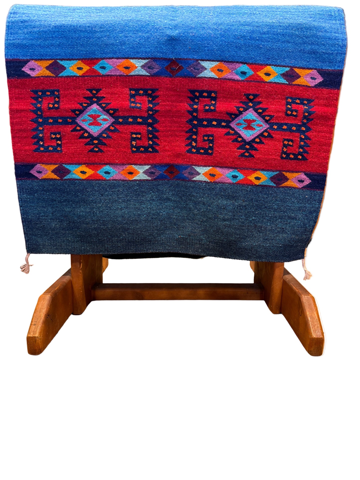 Woven textile with geometric patterns on a wooden loom
