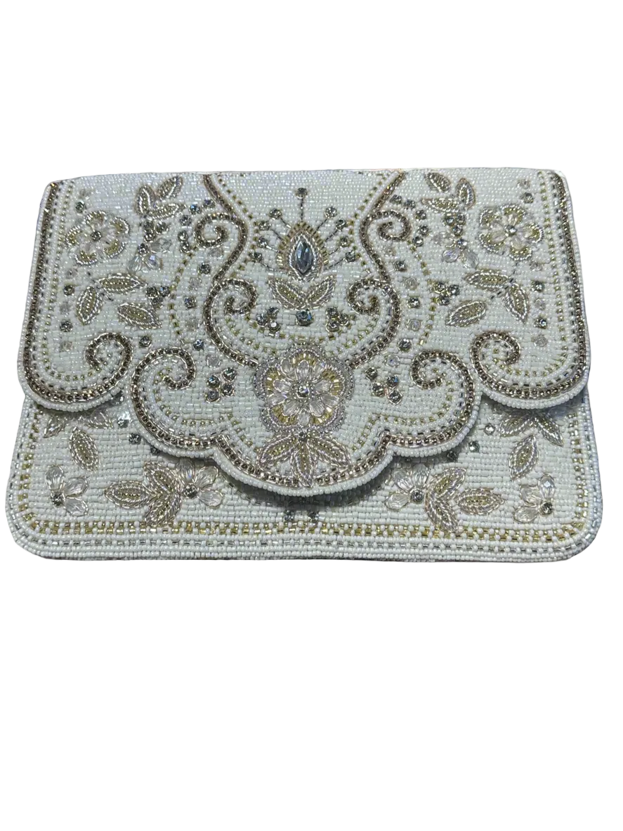 Decorative clutch bag with intricate patterns on a white background