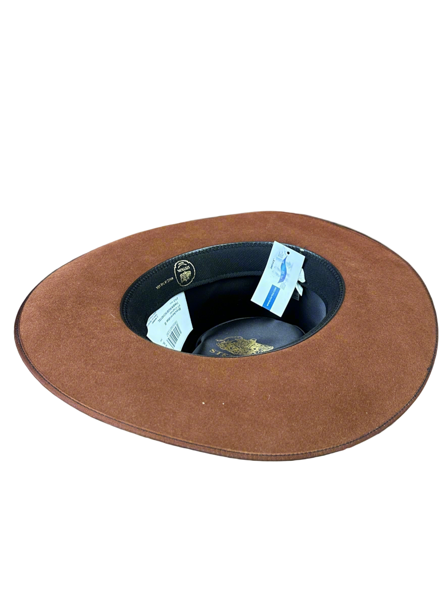 Brown hat with a white label on a white background