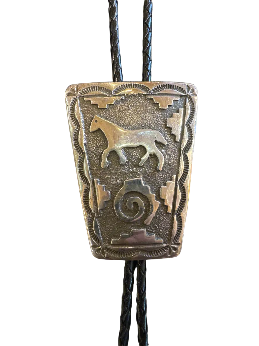 Bronze bolo tie with horse design on a white background