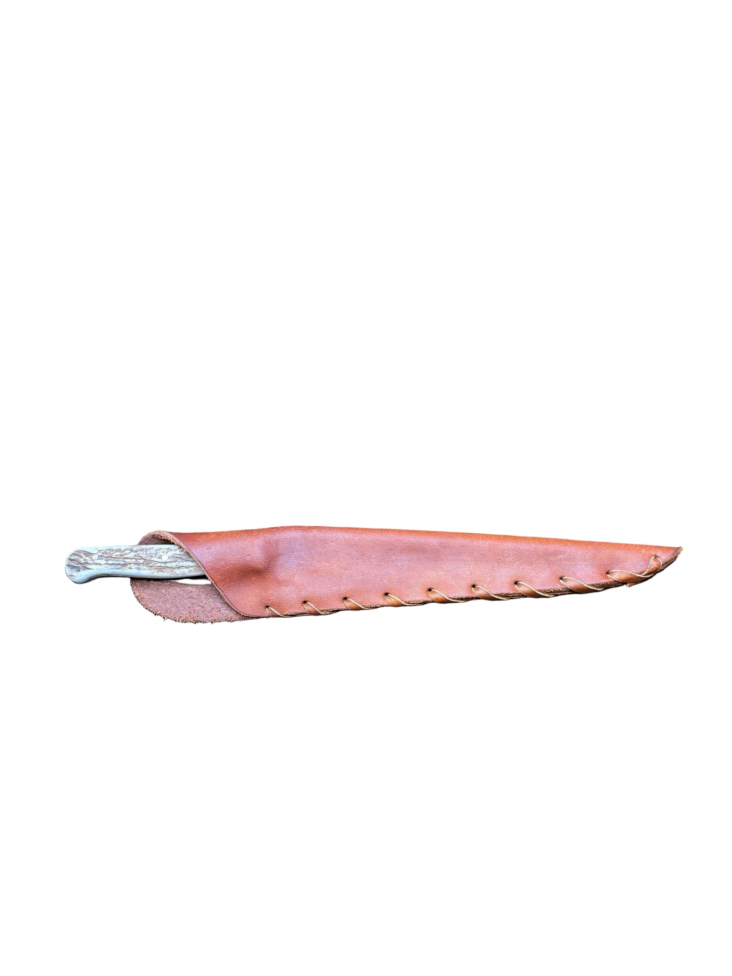 Leather sheath on a black mat with wooden background
