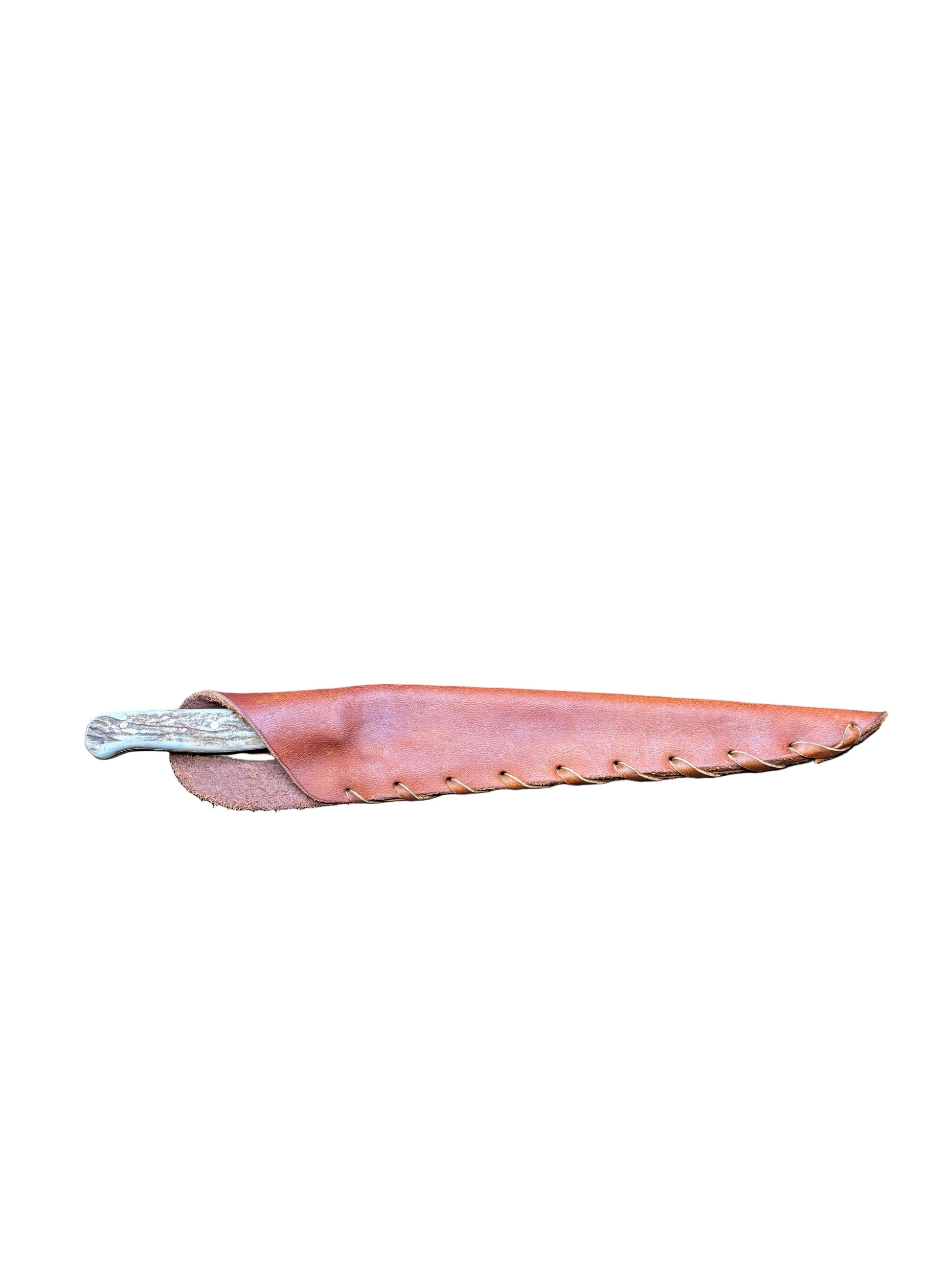 Leather sheath on a black mat with wooden background