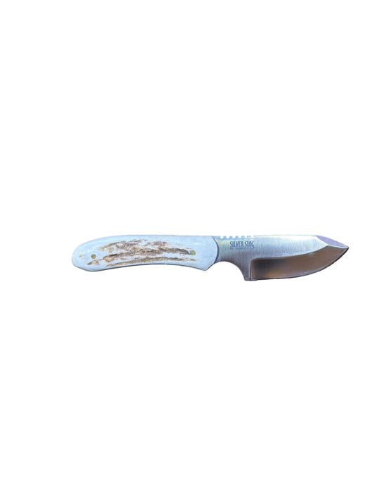Knife with a white handle on a textured black surface