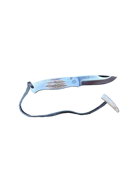 Knife with a sheath on a textured surface