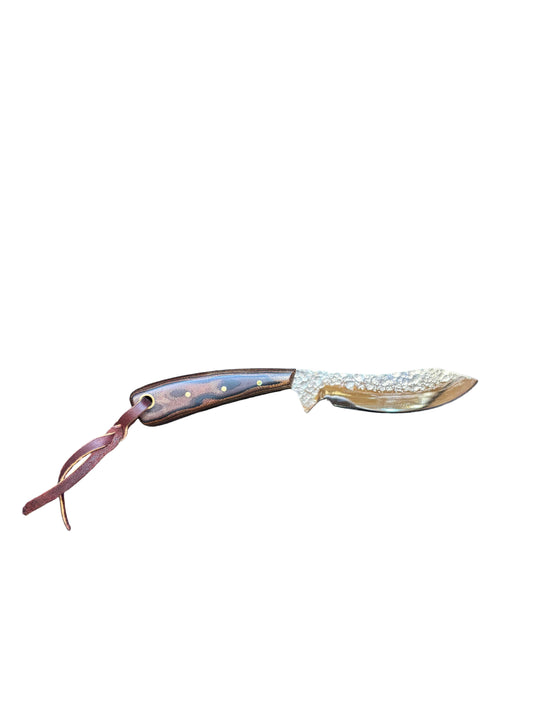Decorative curved blade with a decorative handle on a white background