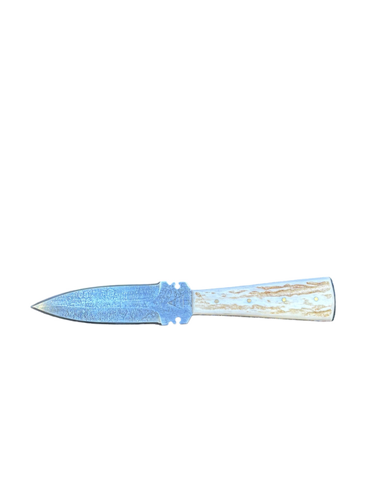 Decorative knife with a blue blade and wooden handle on a white background