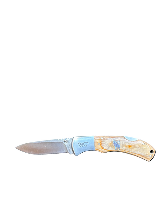 Folding knife with a decorative handle on a white background