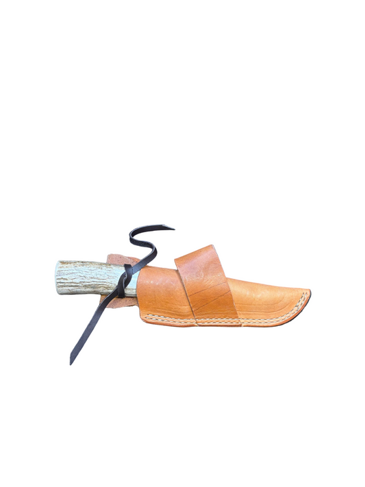 Brown leather sandal with a black strap on a white background