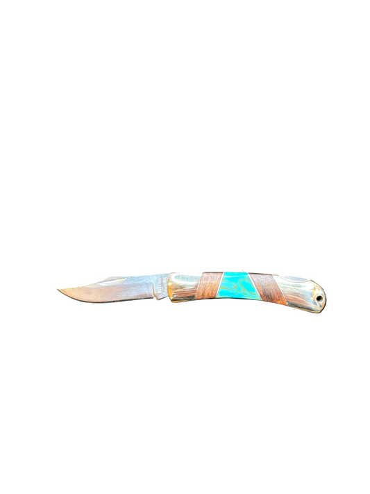 Small pocket knife with a decorative handle on a white background