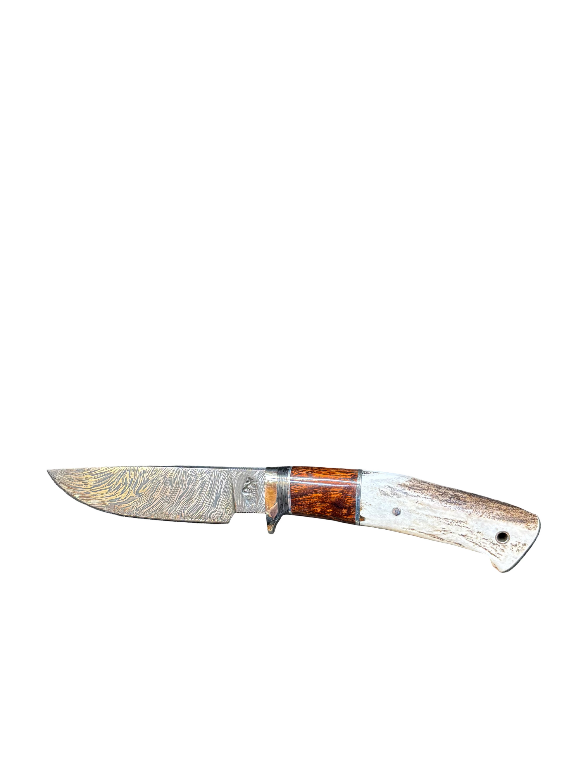 Knife with a decorative blade and wooden handle on a white background