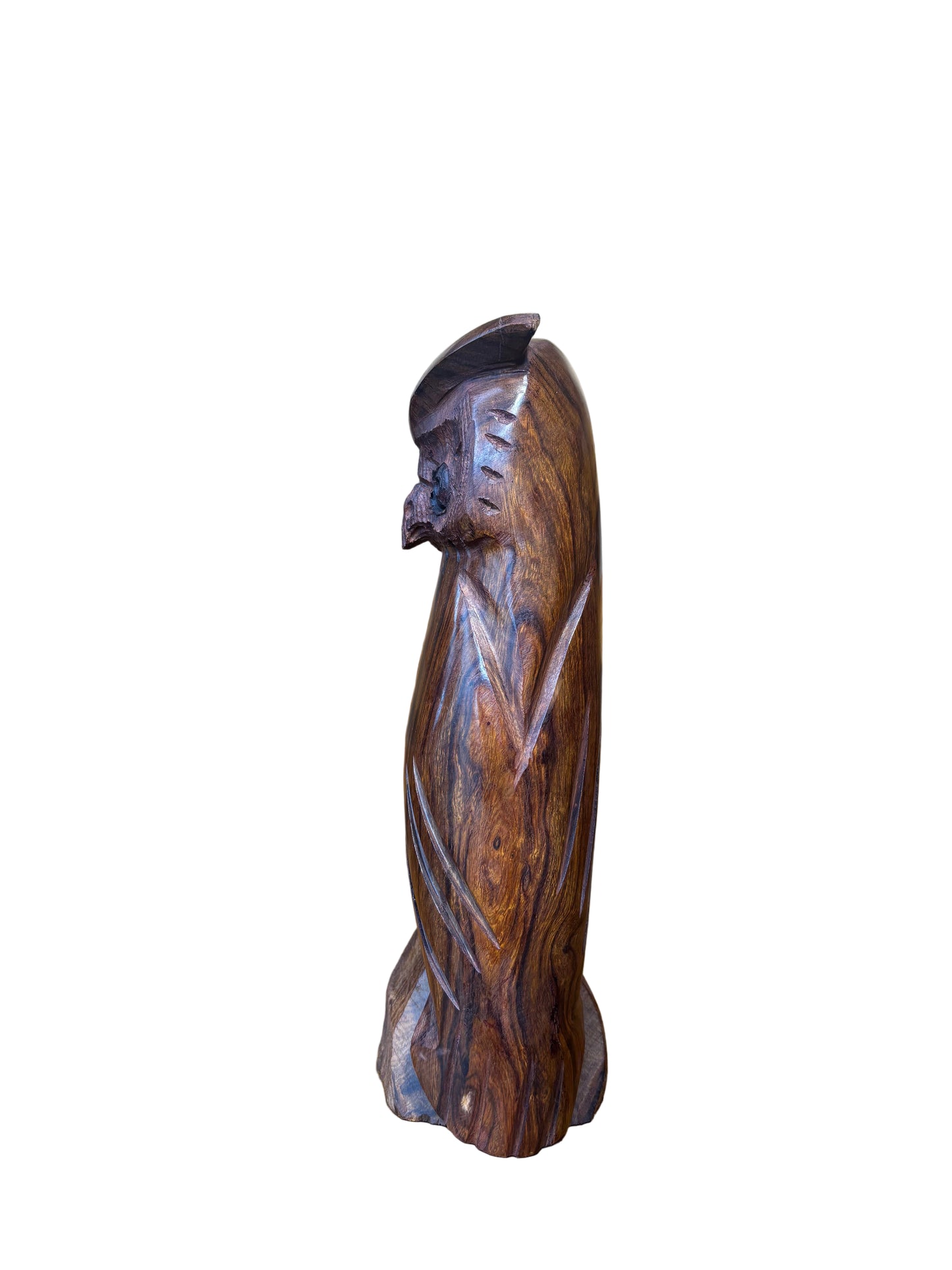Wooden object with intricate carvings on a wooden surface