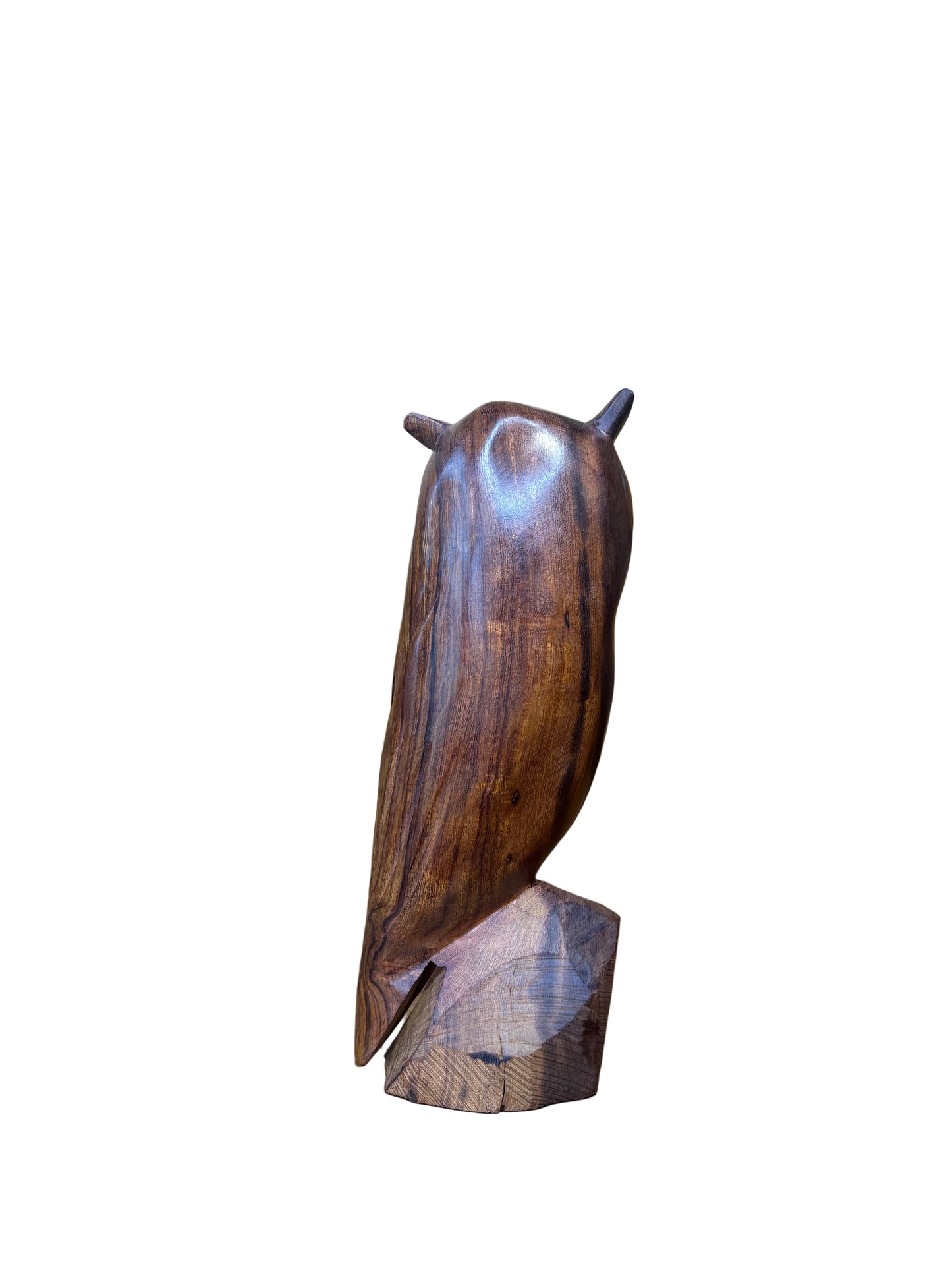 Wooden sculpture of a fish on a wooden shelf