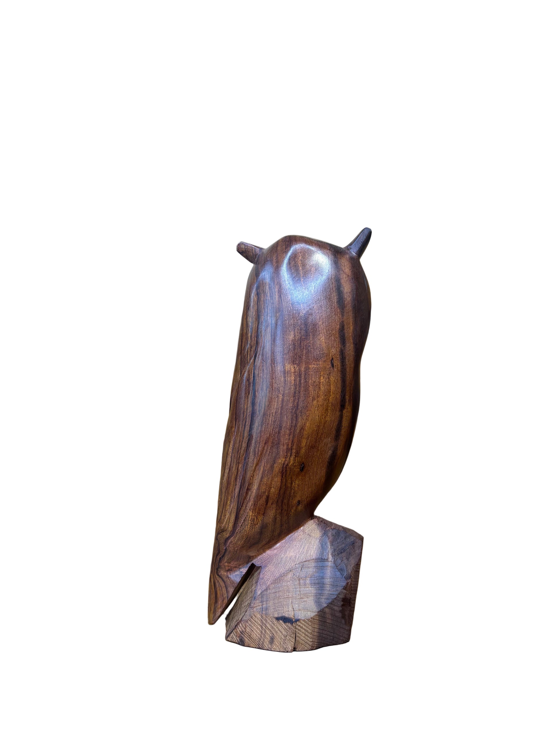 Wooden sculpture of a fish on a wooden shelf