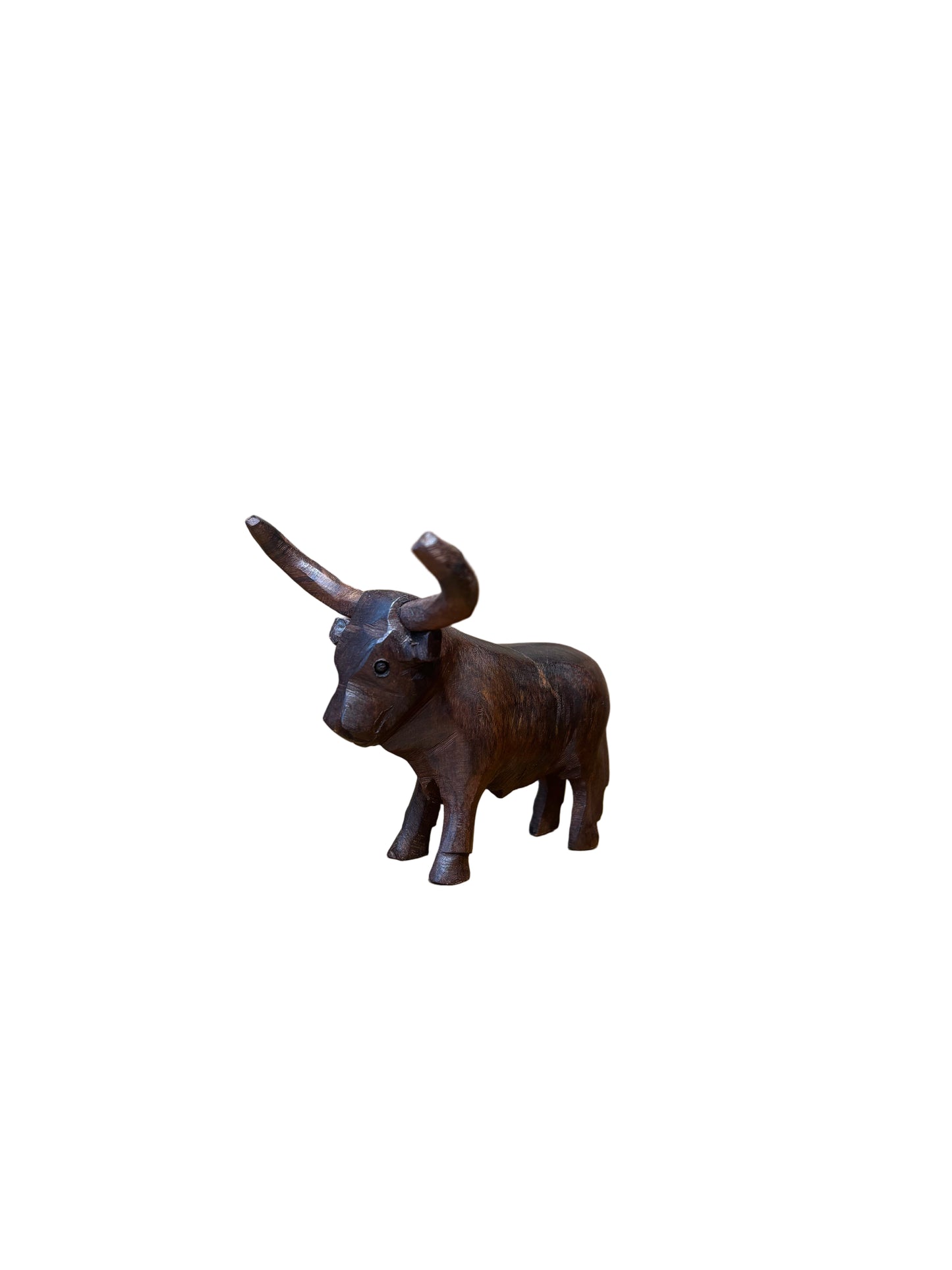 Decorative metal dog hook on a wooden surface