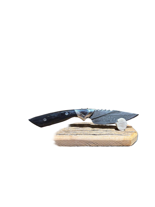 Knife with wooden handle on a patterned fabric background