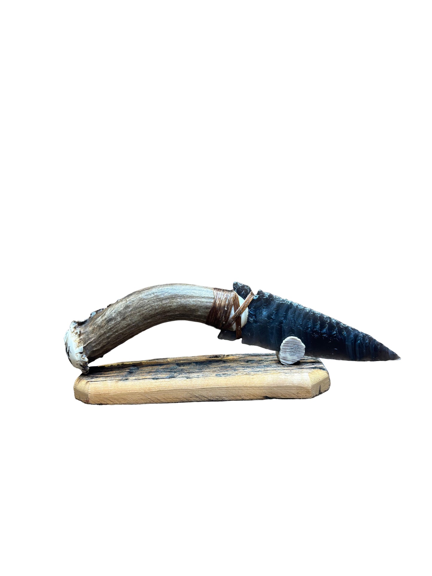 Sword with decorative sheath on a textured surface