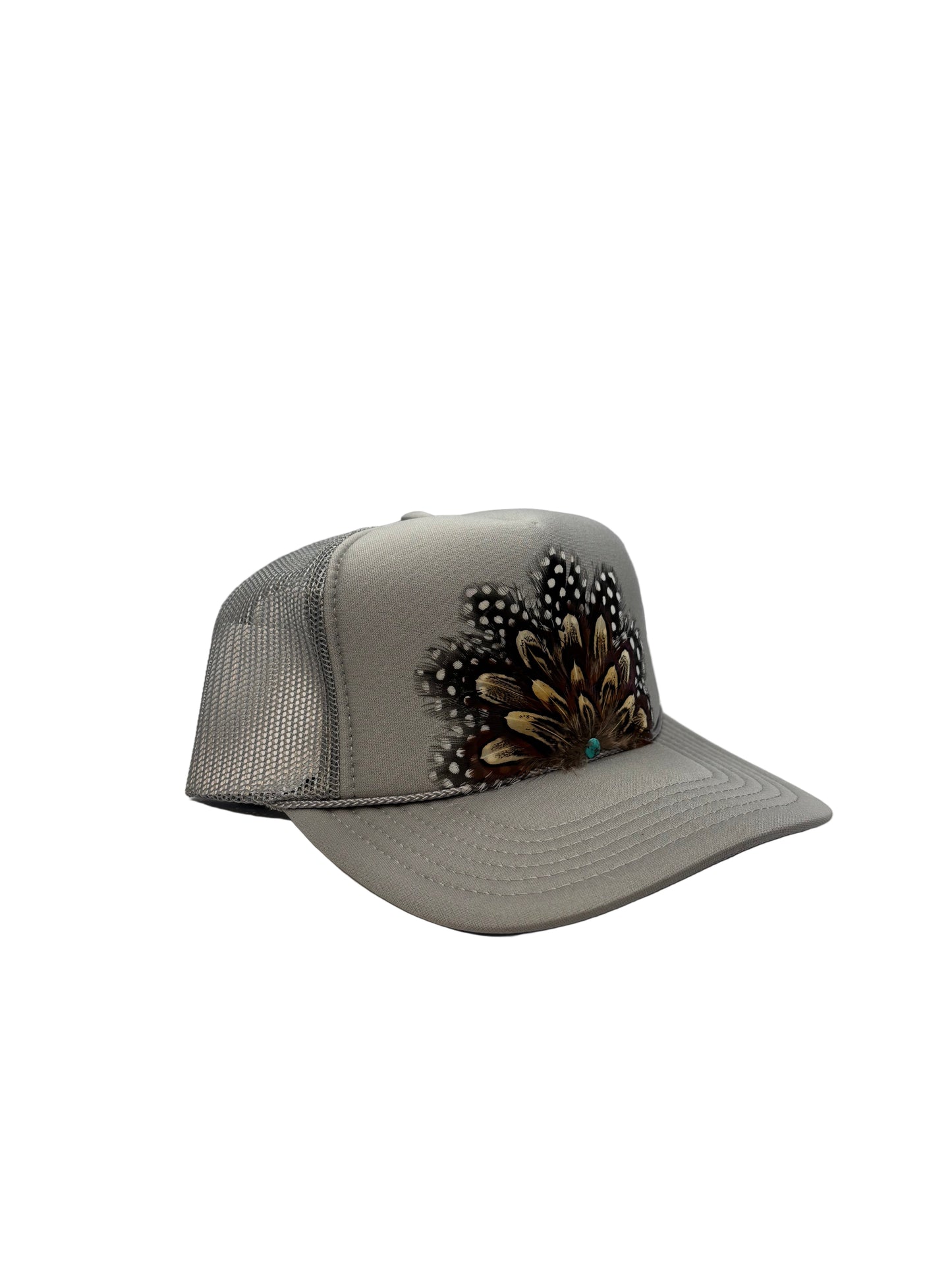 Gray visor with decorative feathers on a white background