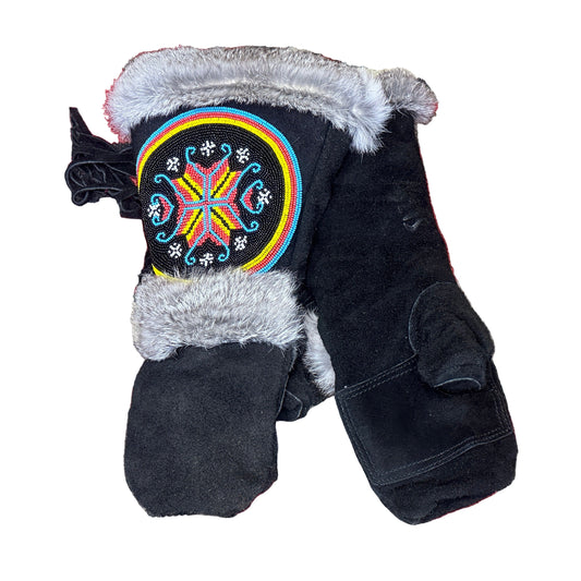 Black jacket with colorful geometric design on a patterned rug